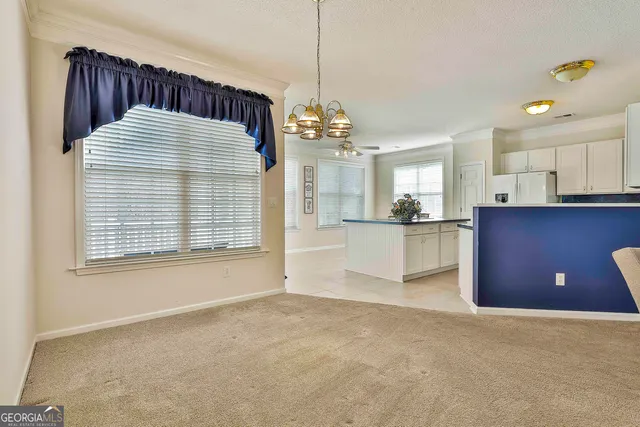 a view of a kitchen with a sink and cabinets