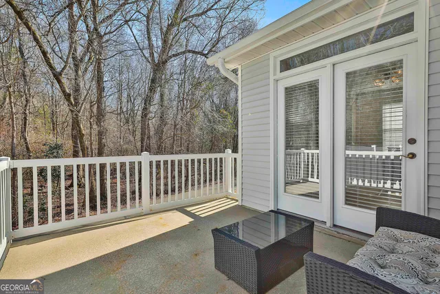 a balcony with couch and city view