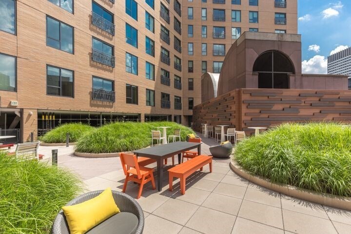 1 Canal Street, Unit 738 Boston, MA 02114 - Photo 11 of 12 a view of a chairs and tables in the patio