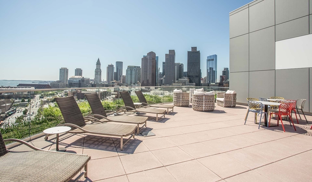 1 Canal Street, Unit 738 Boston, MA 02114 - Photo 9 of 12 a view of a terrace with chairs