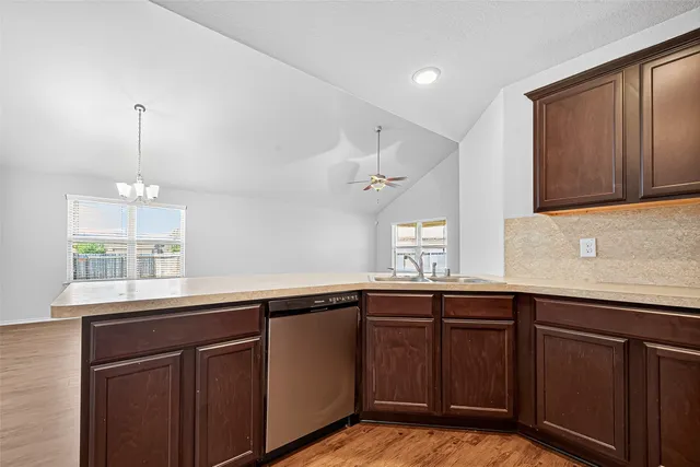 a kitchen with a sink and window