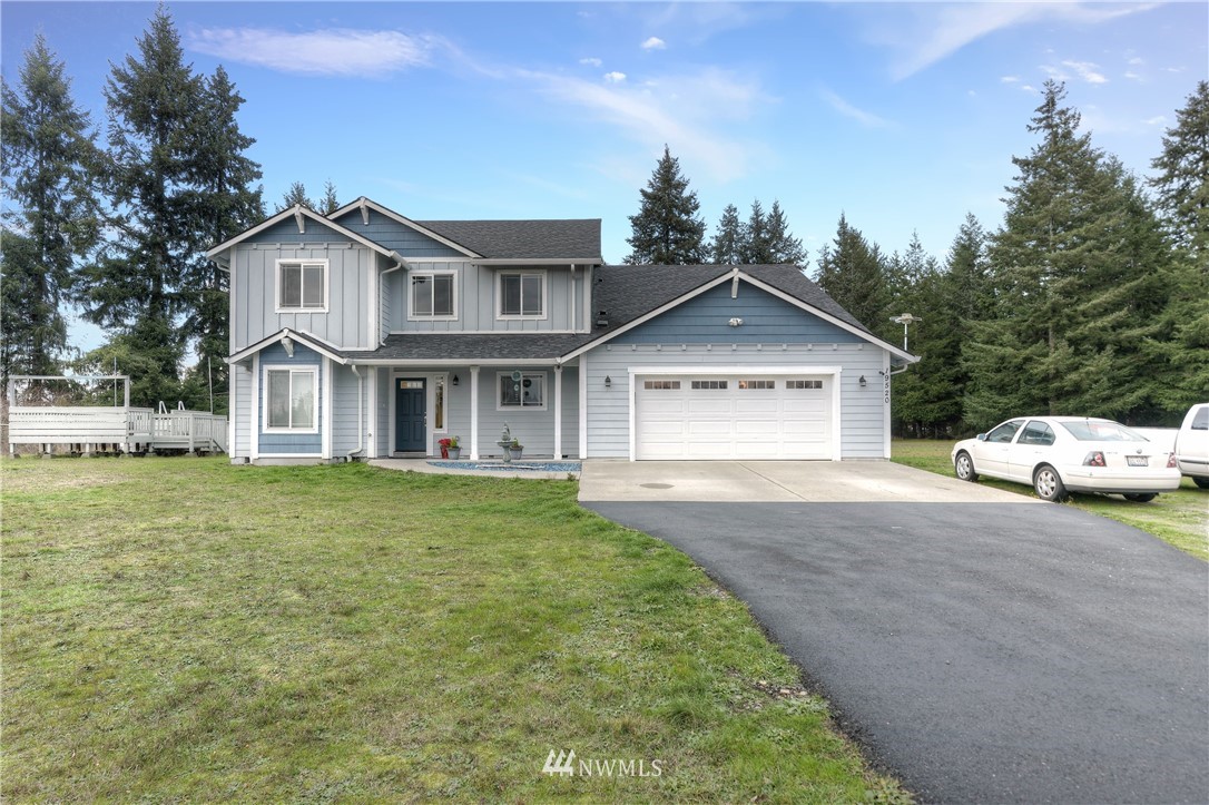 19520 Grand Mound Way Southwest Rochester, WA 98579 - Photo 1 of 34 a front view of a house with a garden and yard