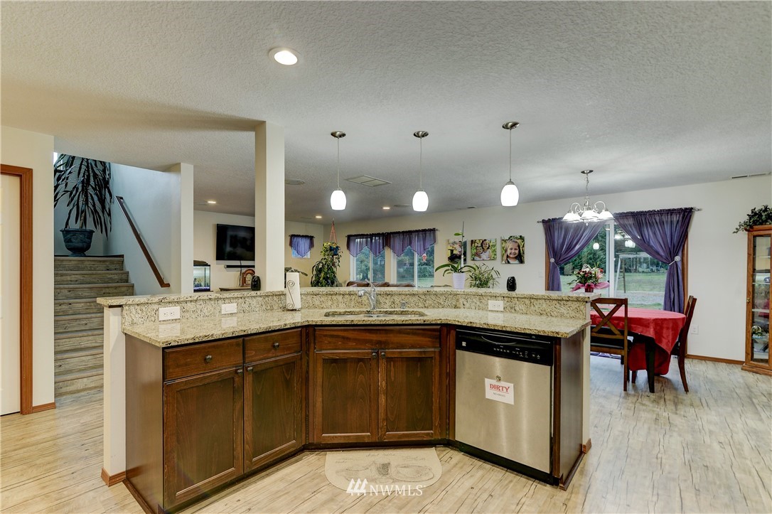 19520 Grand Mound Way Southwest Rochester, WA 98579 - Photo 13 of 34 a kitchen with a sink and cabinets