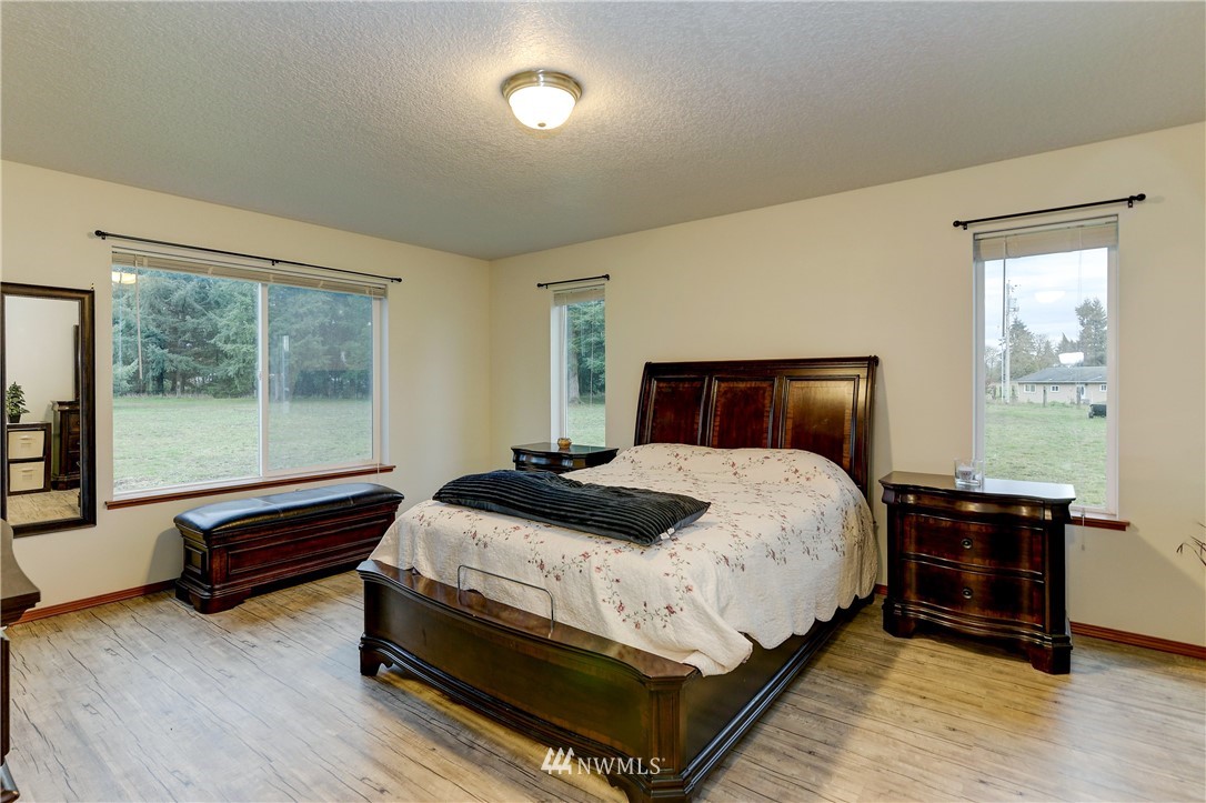 19520 Grand Mound Way Southwest Rochester, WA 98579 - Photo 15 of 34 a bedroom with a bed and window