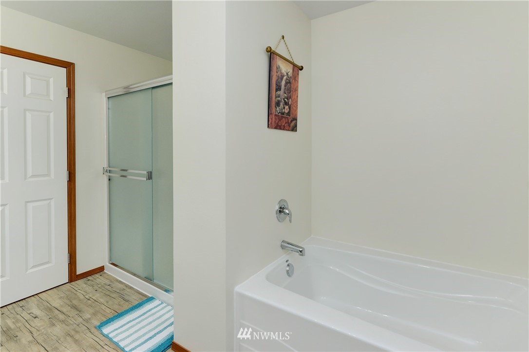 19520 Grand Mound Way Southwest Rochester, WA 98579 - Photo 18 of 34 a bathroom with a bathtub and shower