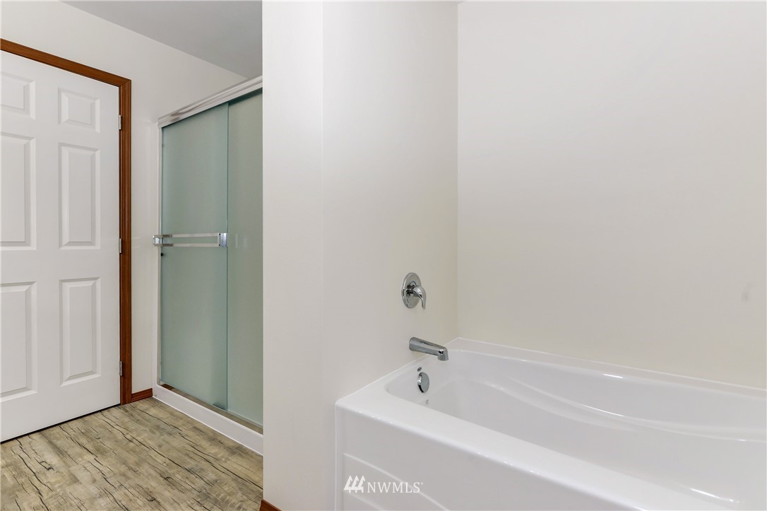 19520 Grand Mound Way Southwest Rochester, WA 98579 - Photo 21 of 34 a bathroom with a tub and shower