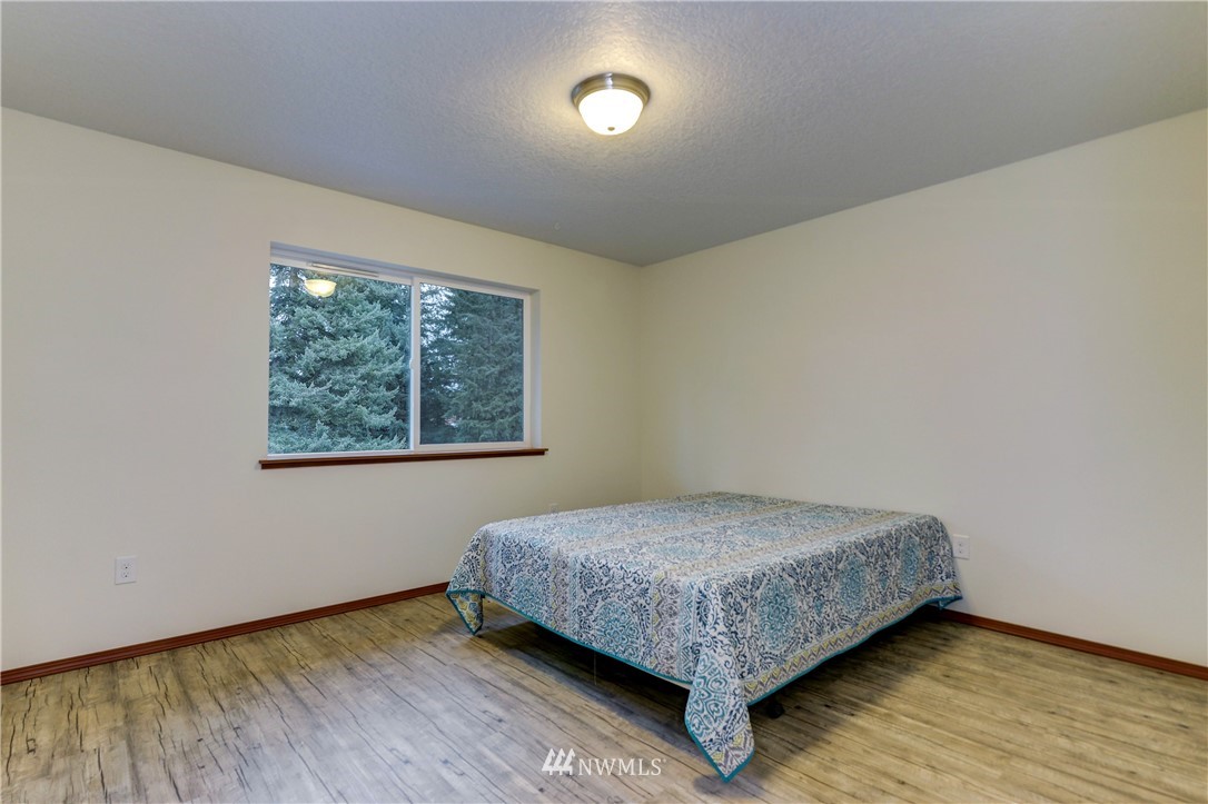 19520 Grand Mound Way Southwest Rochester, WA 98579 - Photo 24 of 34 a bedroom with a bed and window
