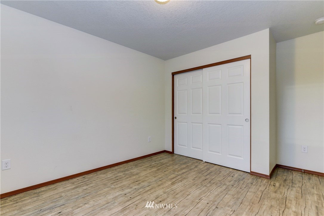 19520 Grand Mound Way Southwest Rochester, WA 98579 - Photo 28 of 34 a view of empty room with wooden floor and fan