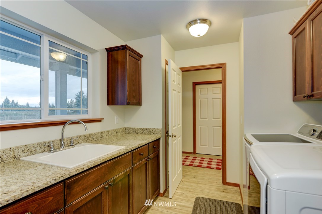 19520 Grand Mound Way Southwest Rochester, WA 98579 - Photo 4 of 34 a bathroom with a sink and a mirror