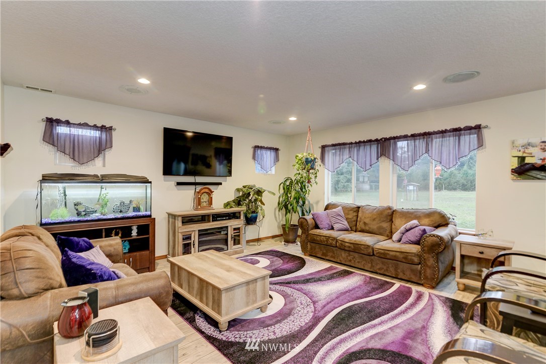 19520 Grand Mound Way Southwest Rochester, WA 98579 - Photo 6 of 34 a living room with furniture and a flat screen tv