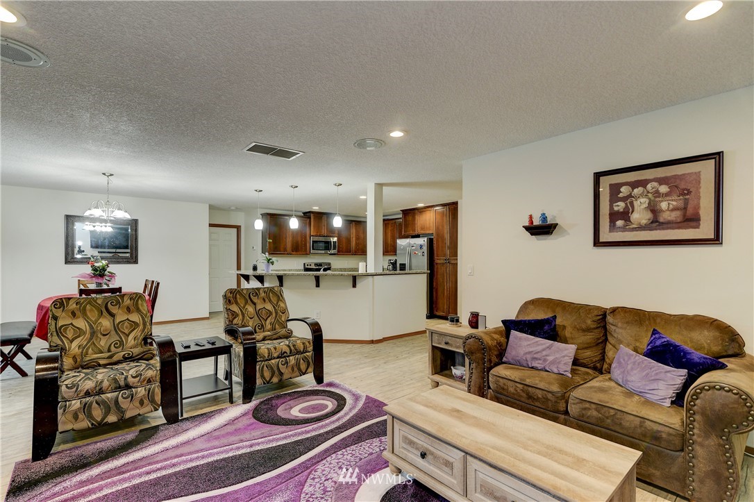 19520 Grand Mound Way Southwest Rochester, WA 98579 - Photo 9 of 34 a living room with furniture and wooden floor