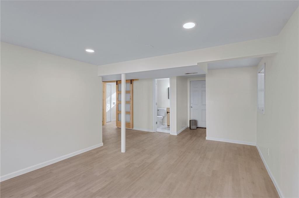 6695 Cedar Hurst Trail Atlanta, GA 30349 - Photo 21 of 24 a view of an empty room with a gallery