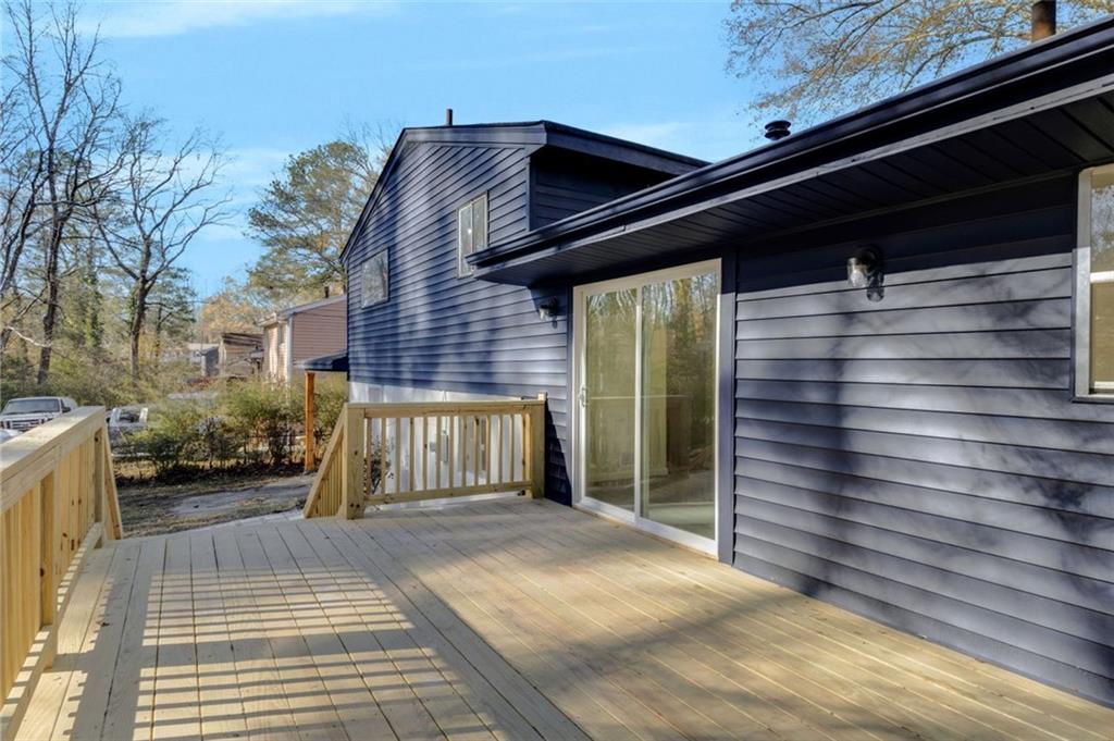 6695 Cedar Hurst Trail Atlanta, GA 30349 - Photo 24 of 24 a view of backyard with cabin