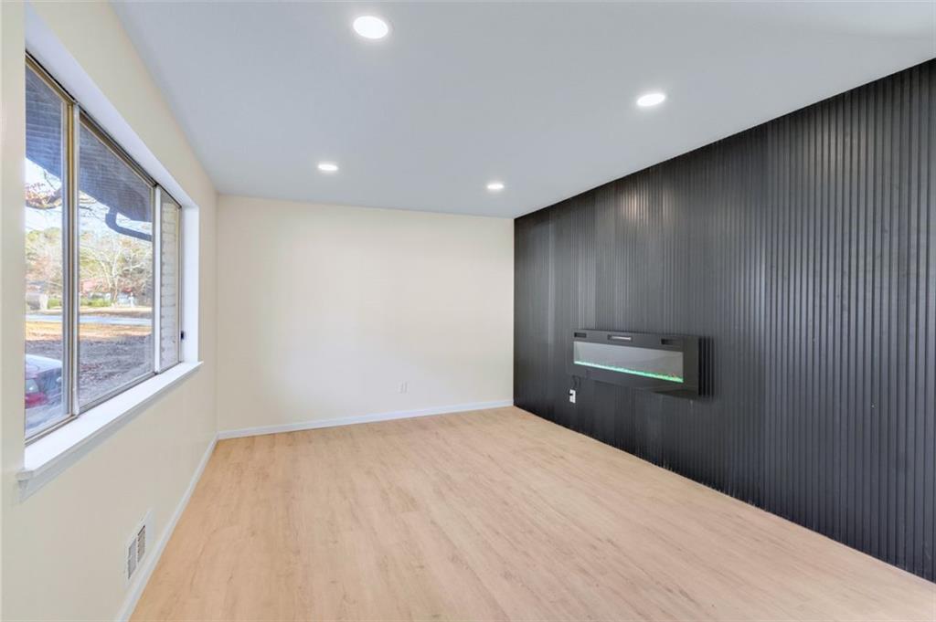6695 Cedar Hurst Trail Atlanta, GA 30349 - Photo 3 of 24 a view of empty room with windows