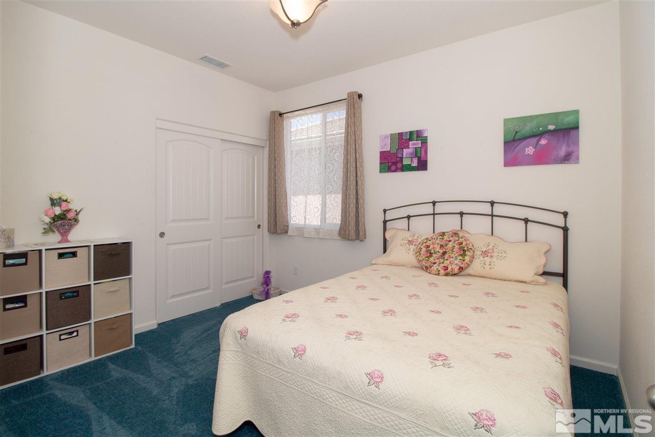 1945 Hope Valley Drive Reno, NV 89521 - Photo 12 of 22 a bedroom with a bed and a window