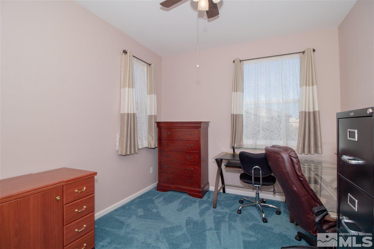 1945 Hope Valley Drive Reno, NV 89521 - Photo 13 of 22 a livingroom with workspace and a window