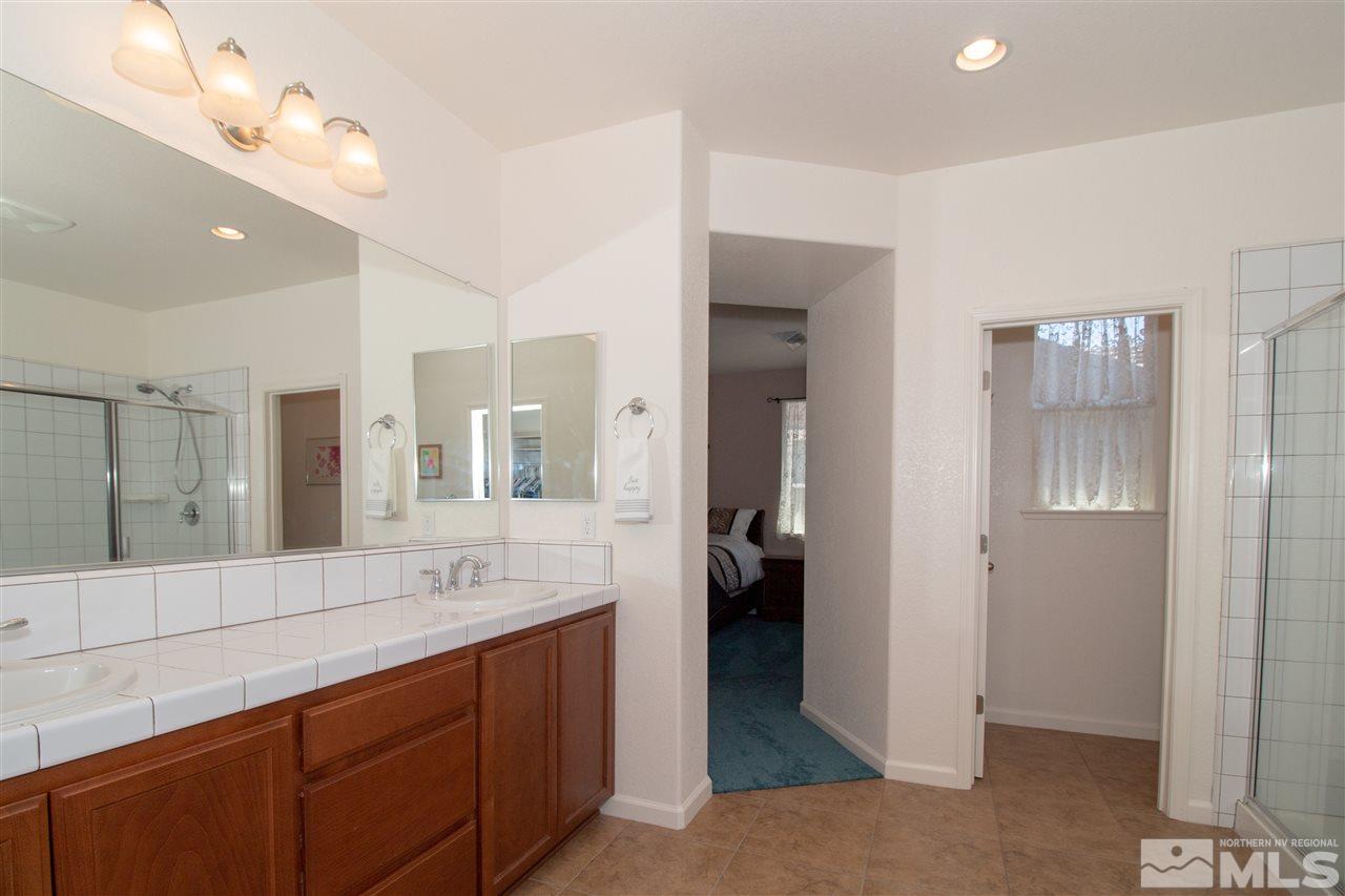 1945 Hope Valley Drive Reno, NV 89521 - Photo 16 of 22 a bathroom with a sink double vanity and a shower
