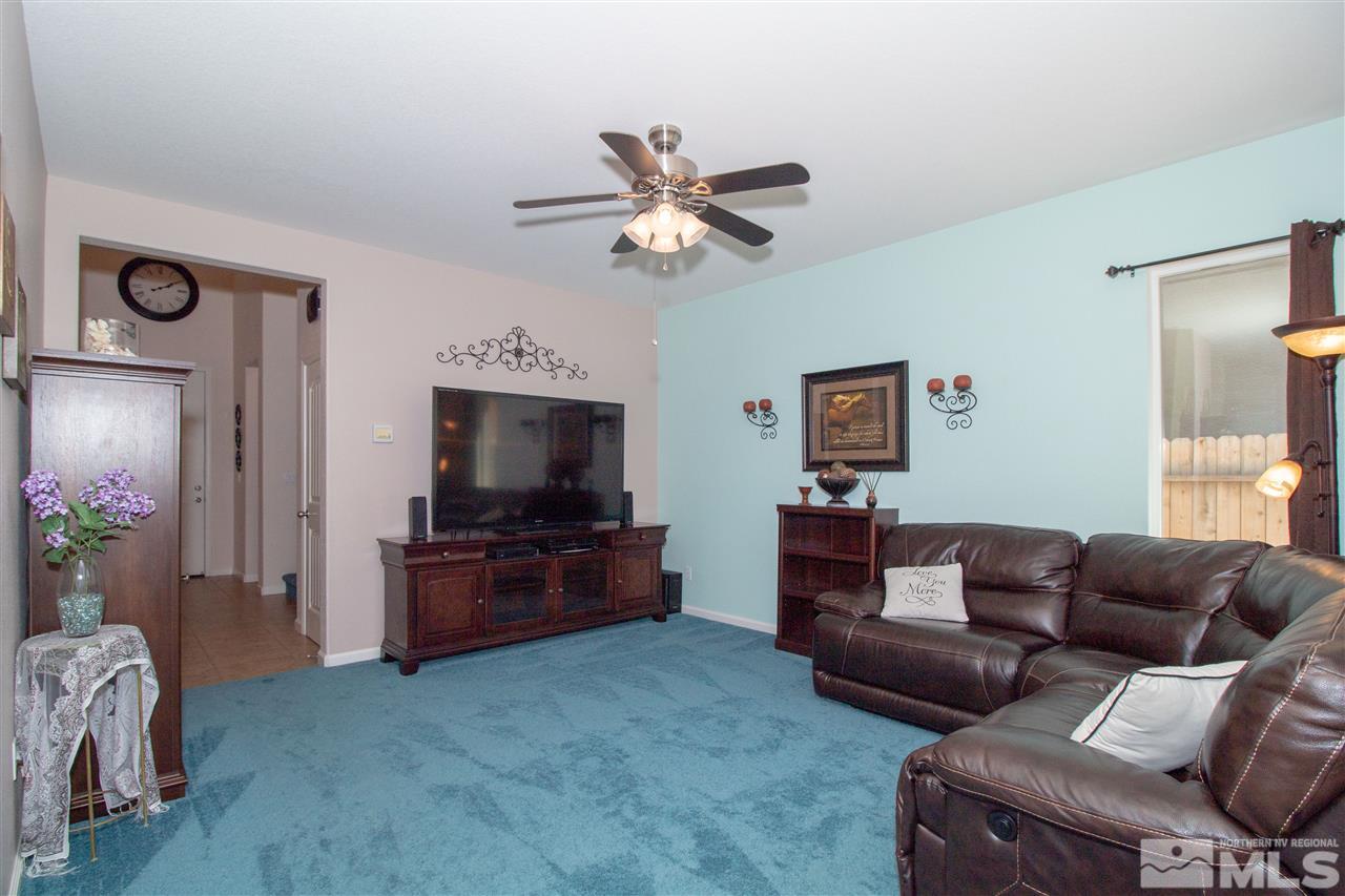 1945 Hope Valley Drive Reno, NV 89521 - Photo 3 of 22 a living room with furniture and a flat screen tv