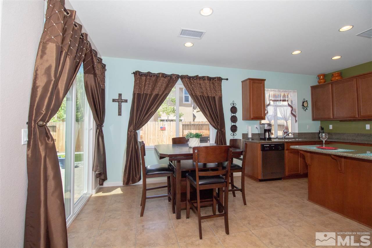 1945 Hope Valley Drive Reno, NV 89521 - Photo 4 of 22 a kitchen with a table chairs and entryway