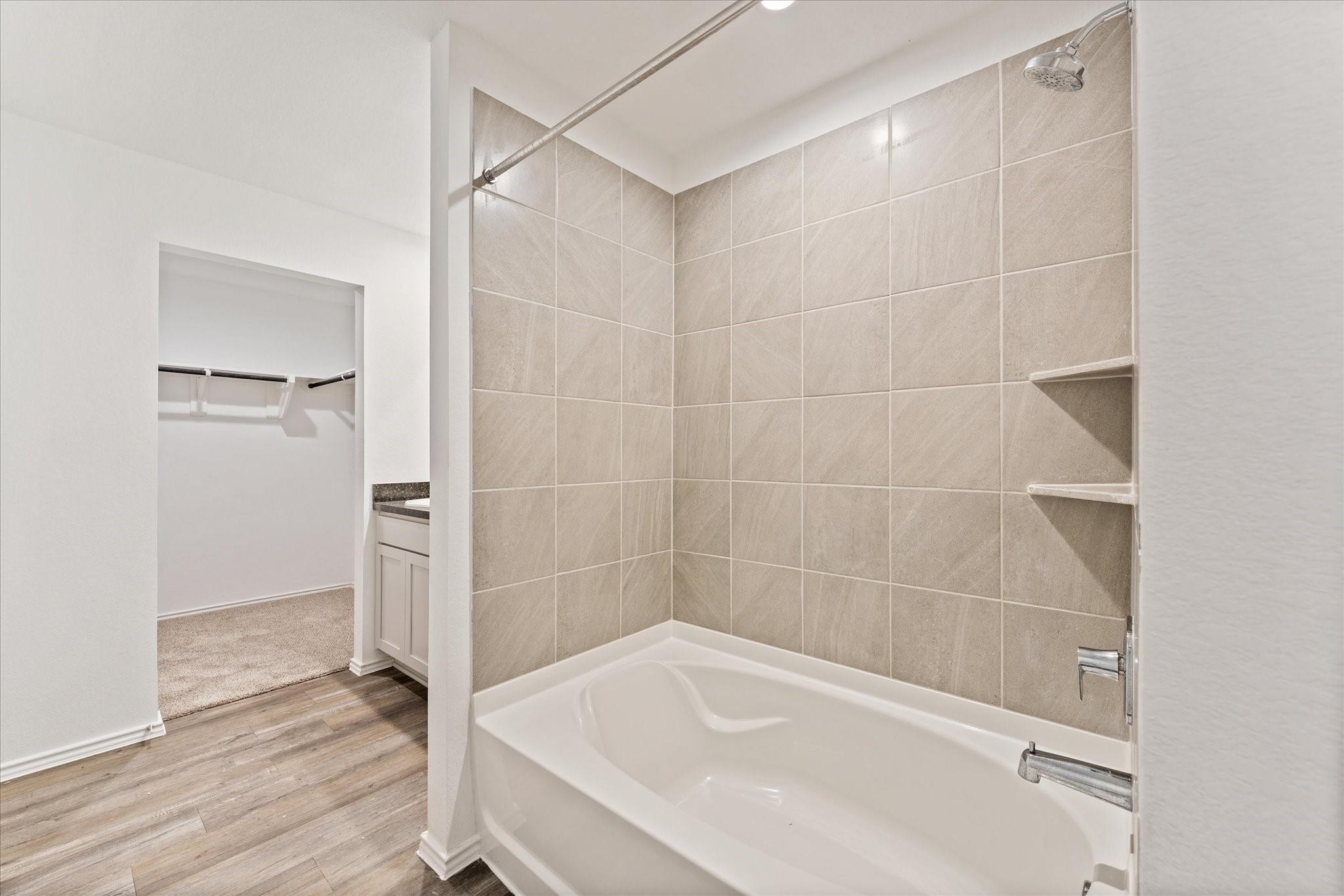 24210 Sandstone Valley Lane Spring, TX 77373 - Photo 19 of 33 a bathroom with a bathtub and a shower