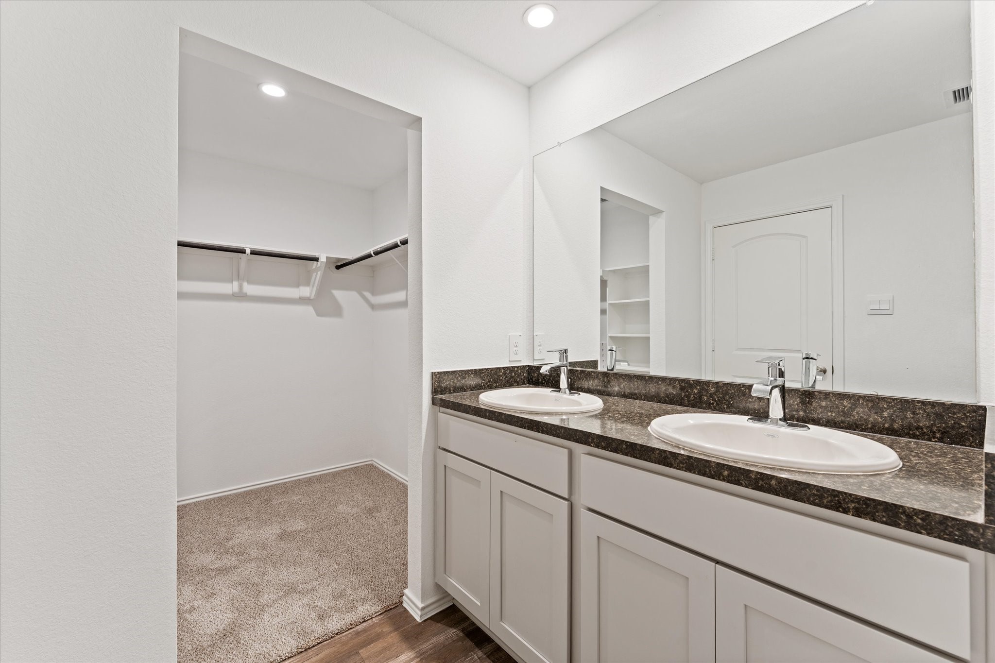 24210 Sandstone Valley Lane Spring, TX 77373 - Photo 20 of 33 a bathroom with a granite countertop sink and a mirror