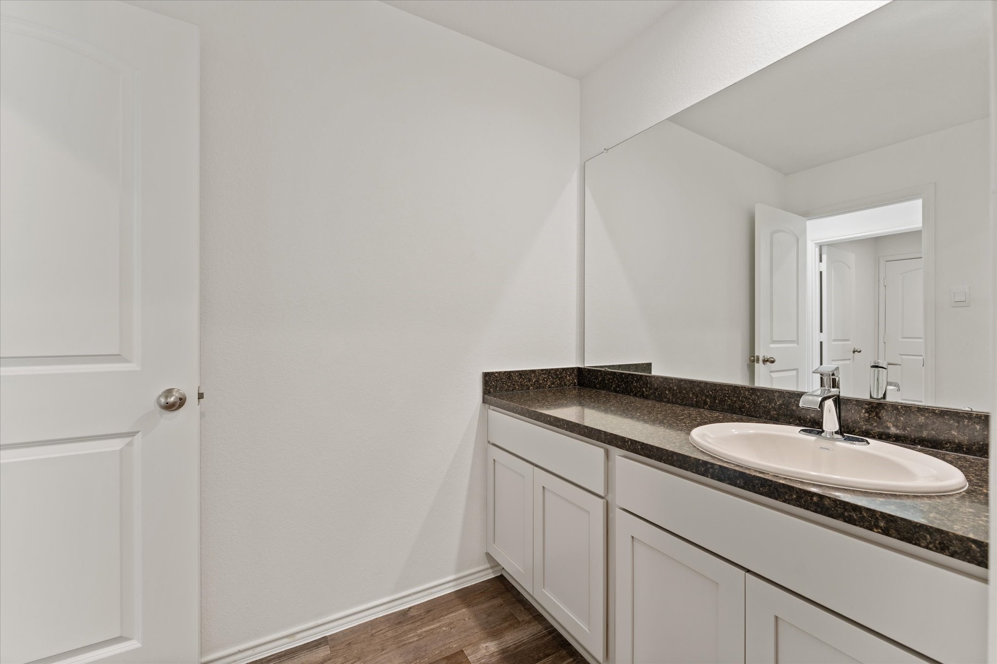 24210 Sandstone Valley Lane Spring, TX 77373 - Photo 25 of 33 a bathroom with a granite countertop sink and a mirror