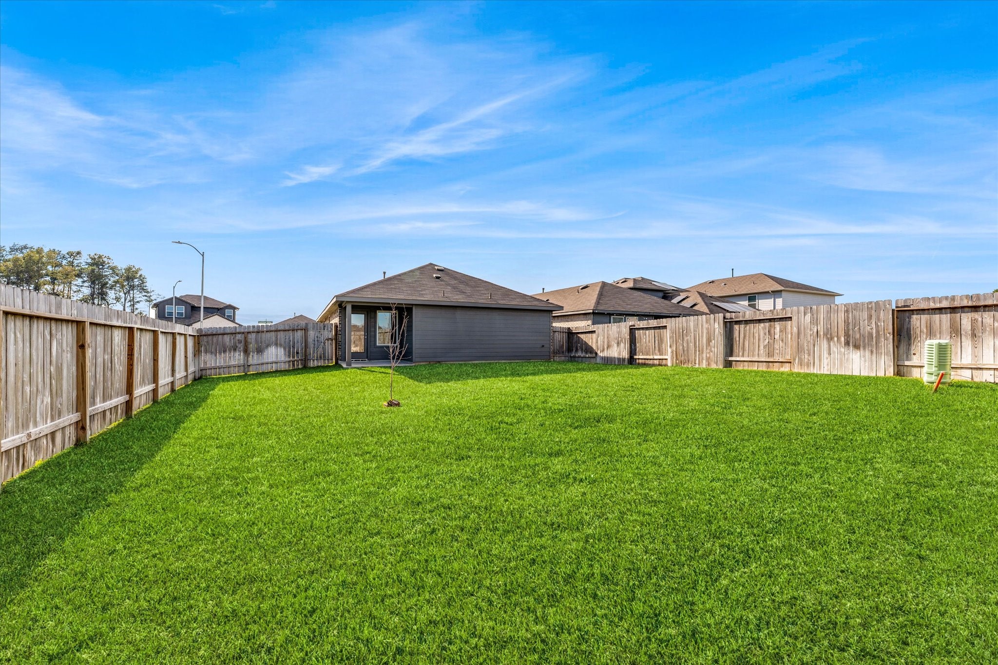 24210 Sandstone Valley Lane Spring, TX 77373 - Photo 5 of 33 a view of a big house with a big yard and large trees