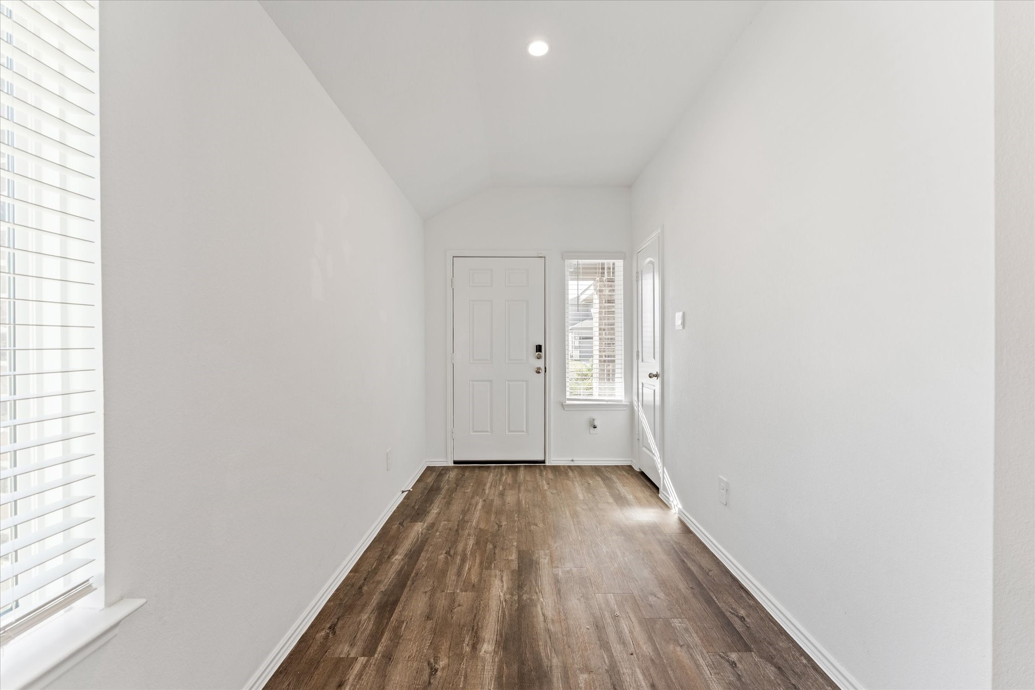 24210 Sandstone Valley Lane Spring, TX 77373 - Photo 8 of 33 an empty room with wooden floor and windows