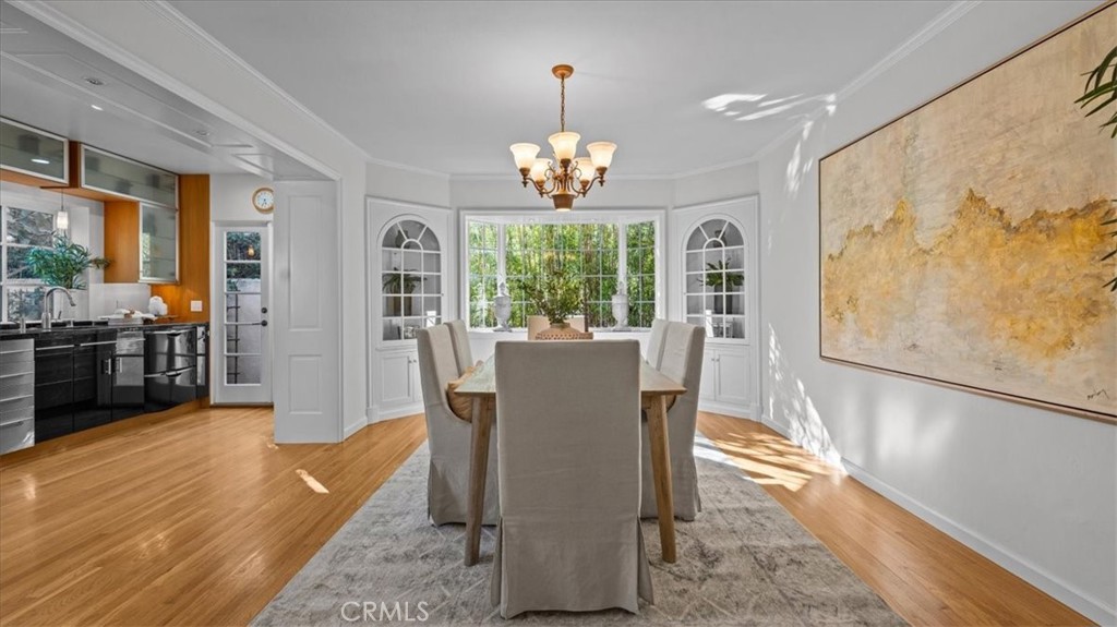 460 University Circle Claremont, CA 91711 - Photo 11 of 41 a view of a dining room with furniture a chandelier and wooden floor