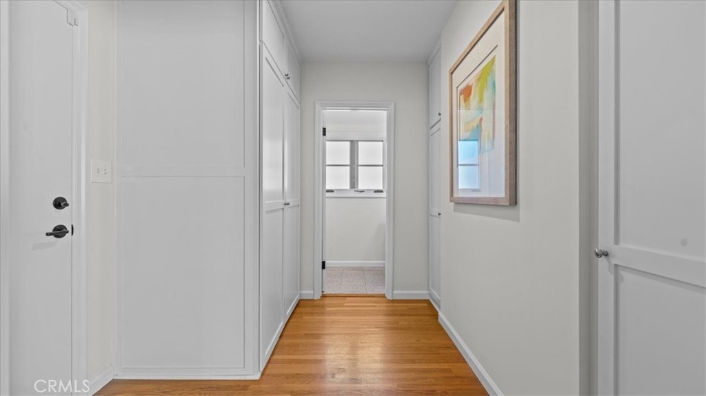 460 University Circle Claremont, CA 91711 - Photo 15 of 41 a view of a hallway with wooden floor and a bathroom