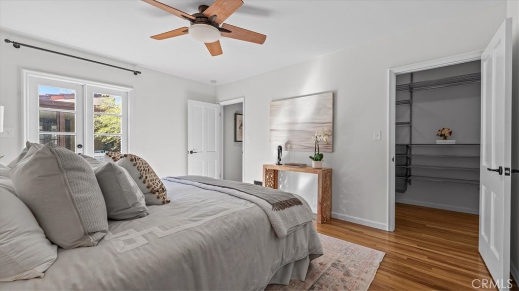 460 University Circle Claremont, CA 91711 - Photo 18 of 41 a bedroom with a bed and a chandelier