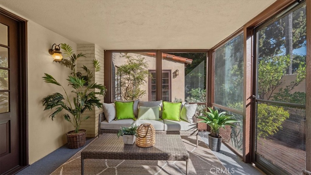 460 University Circle Claremont, CA 91711 - Photo 28 of 41 a living room with furniture and a potted plant