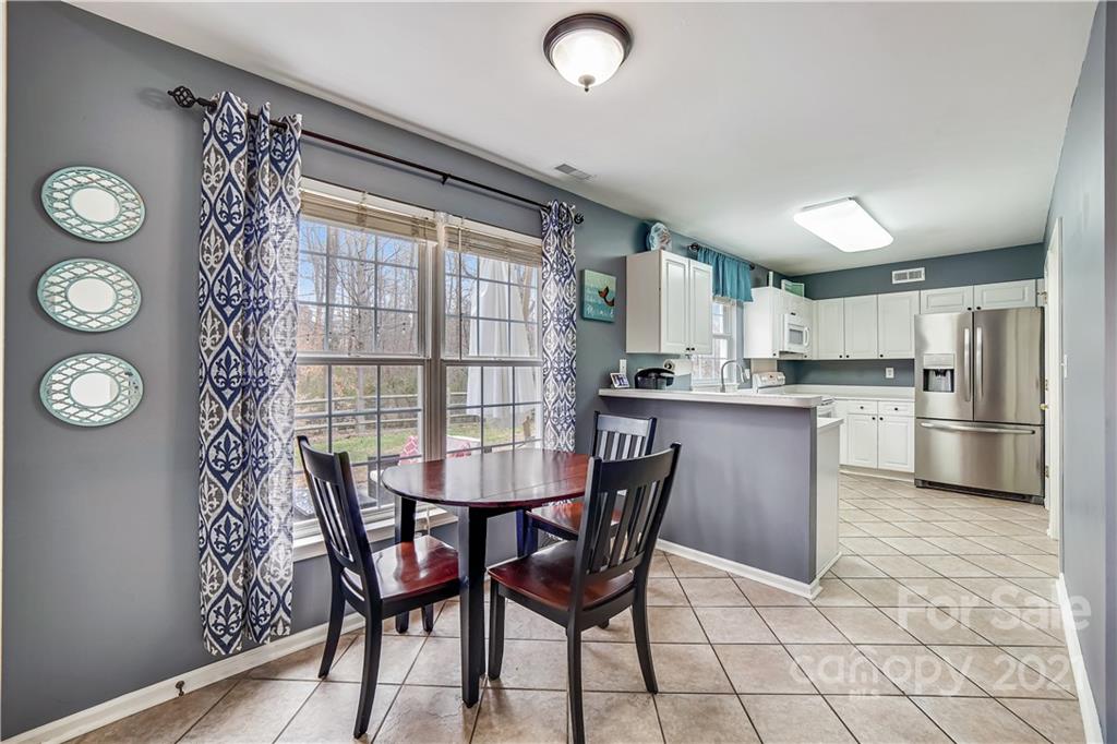 3795 Kennedy Road Gastonia, NC 28056 - Photo 12 of 32 a view of a dining room with furniture and a window
