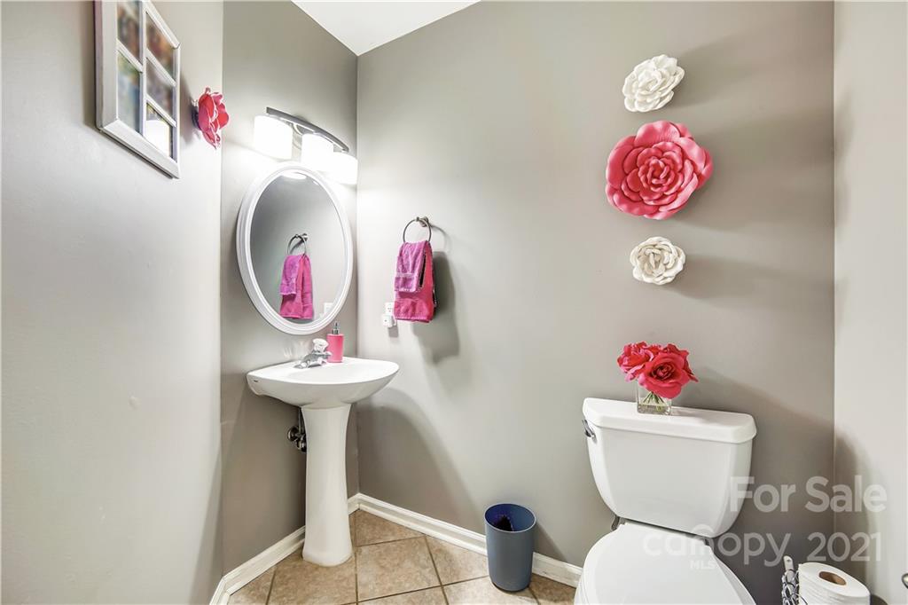 3795 Kennedy Road Gastonia, NC 28056 - Photo 13 of 32 a bathroom with a toilet and a sink