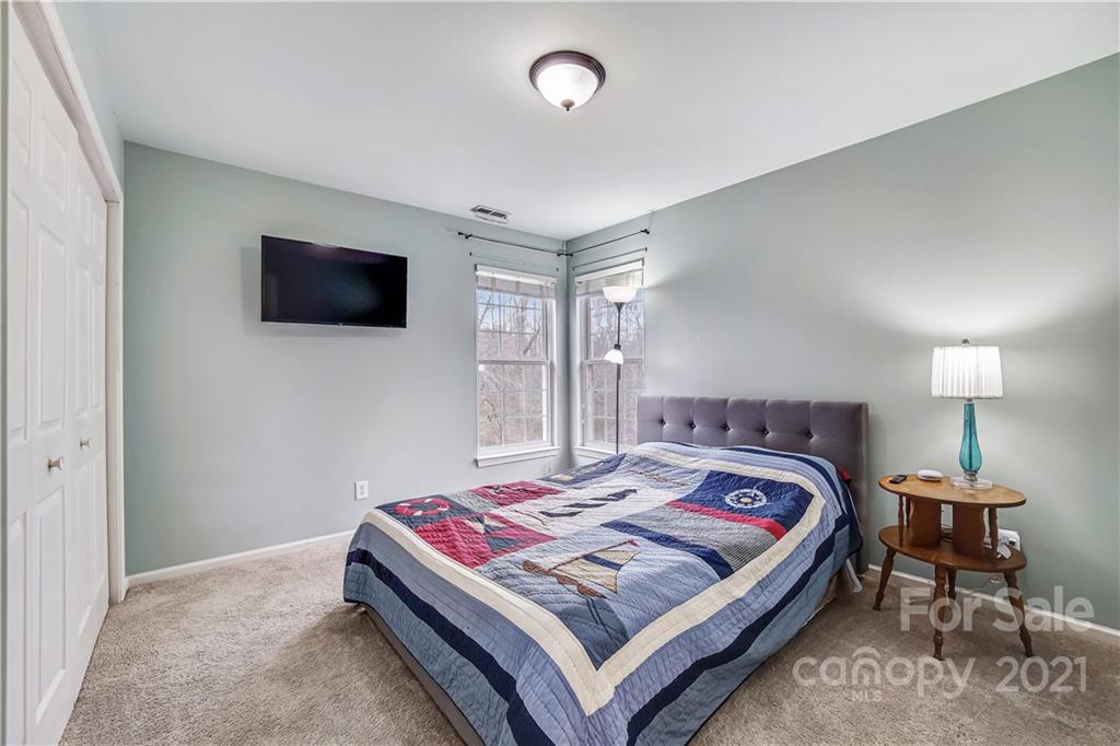 3795 Kennedy Road Gastonia, NC 28056 - Photo 19 of 32 a bedroom with a bed and a flat screen tv