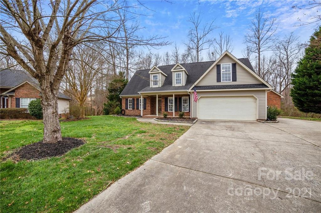 3795 Kennedy Road Gastonia, NC 28056 - Photo 2 of 32 a front view of a house with a yard and trees