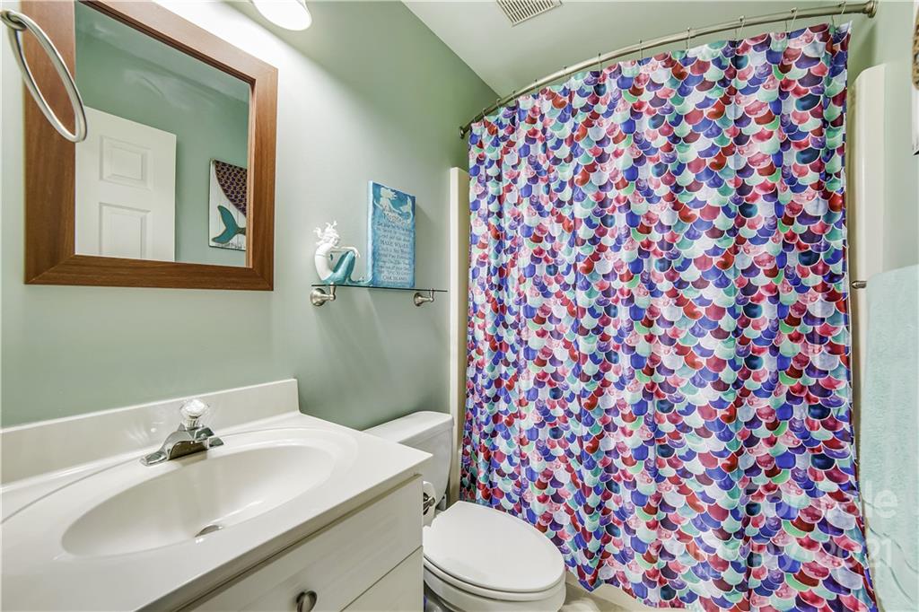 3795 Kennedy Road Gastonia, NC 28056 - Photo 21 of 32 a bathroom with a sink toilet and mirror