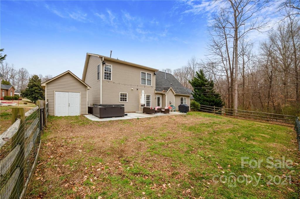 3795 Kennedy Road Gastonia, NC 28056 - Photo 28 of 32 a view of a house with backyard and trees