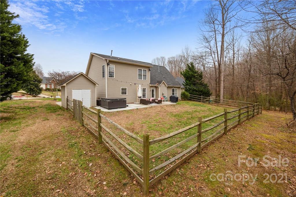 3795 Kennedy Road Gastonia, NC 28056 - Photo 29 of 32 a view of a white house with a big yard next to a road