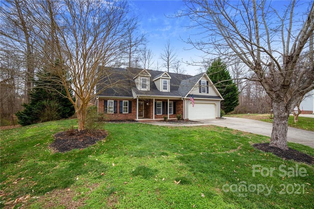 3795 Kennedy Road Gastonia, NC 28056 - Photo 3 of 32 a front view of a house with a garden