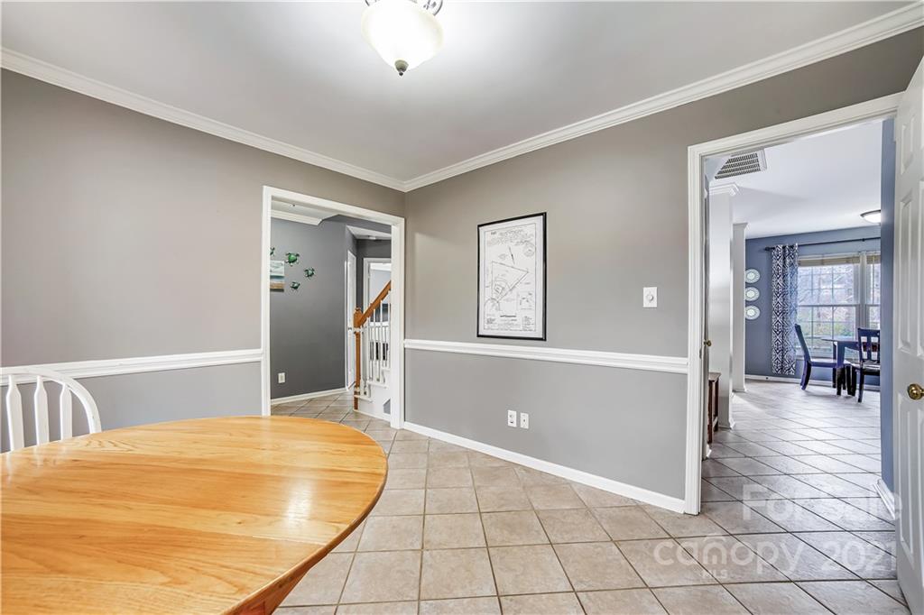 3795 Kennedy Road Gastonia, NC 28056 - Photo 6 of 32 a bedroom with a bed and a chandelier