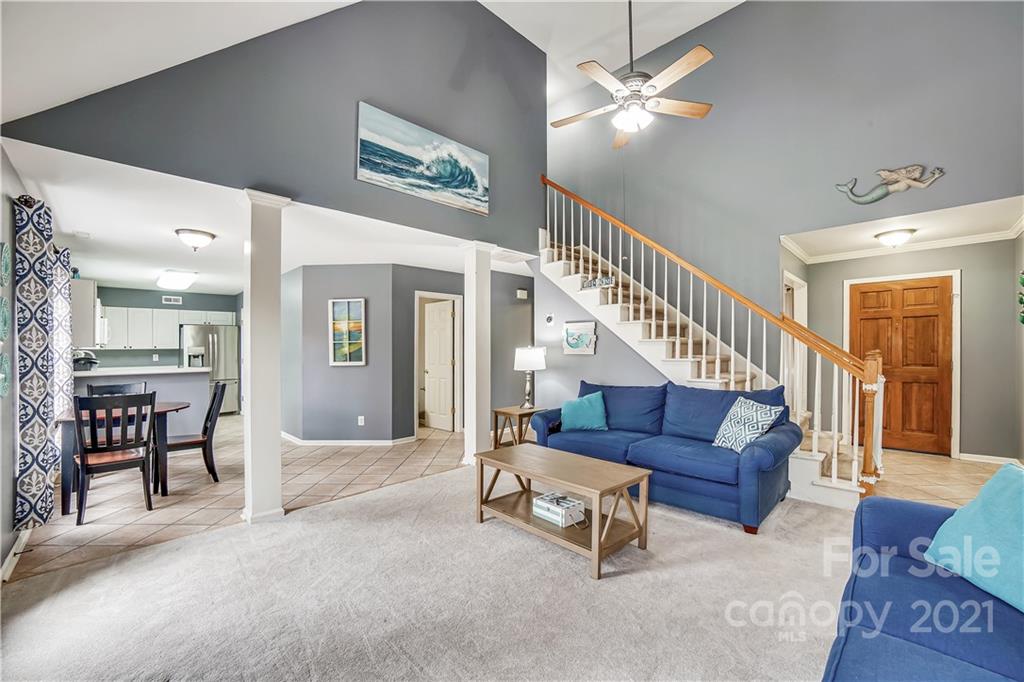 3795 Kennedy Road Gastonia, NC 28056 - Photo 7 of 32 a living room with furniture and a chandelier