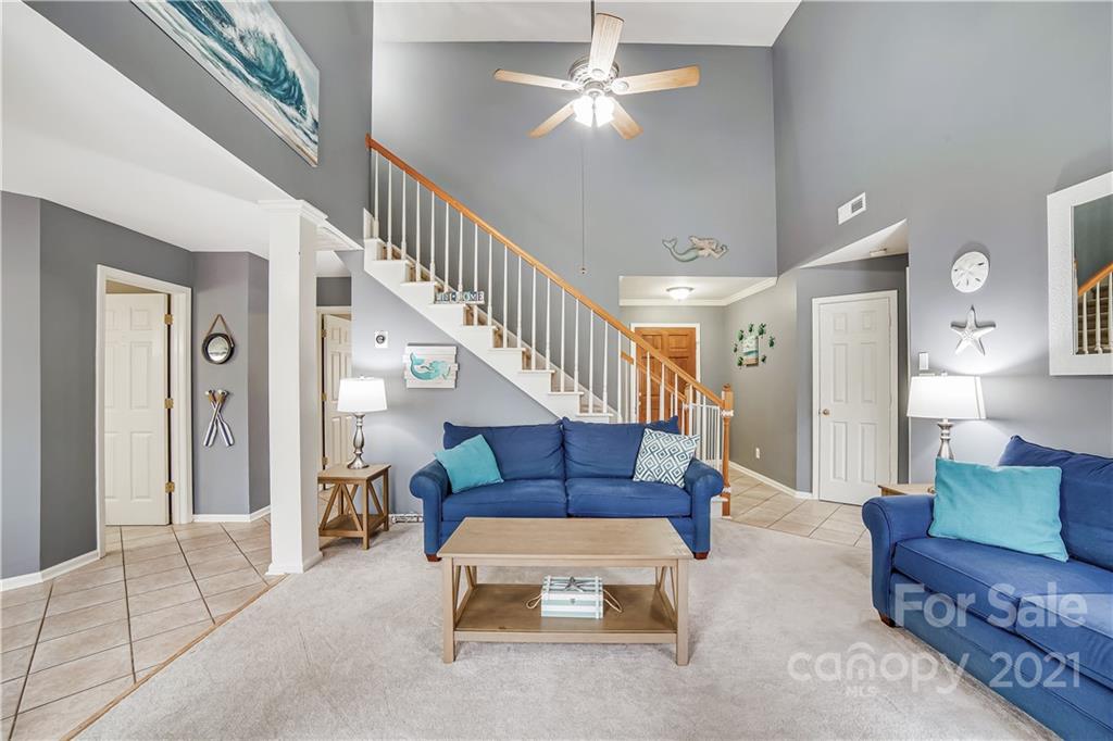 3795 Kennedy Road Gastonia, NC 28056 - Photo 9 of 32 a living room with furniture and a chandelier
