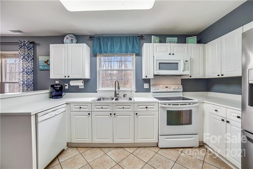 3795 Kennedy Road Gastonia, NC 28056 - Photo 10 of 32 a kitchen with cabinets appliances a sink and a window