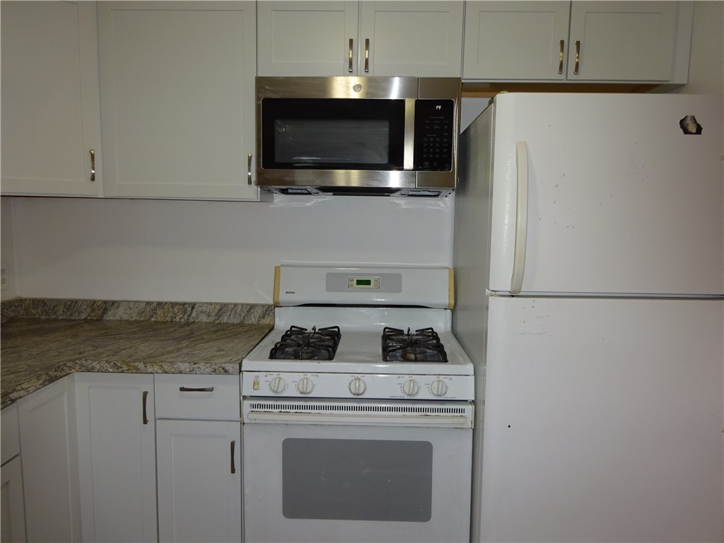 115 Murray Street Rochester, NY 14606 - Photo 13 of 35 Stove, refrigerator, and microwave in Apt #2