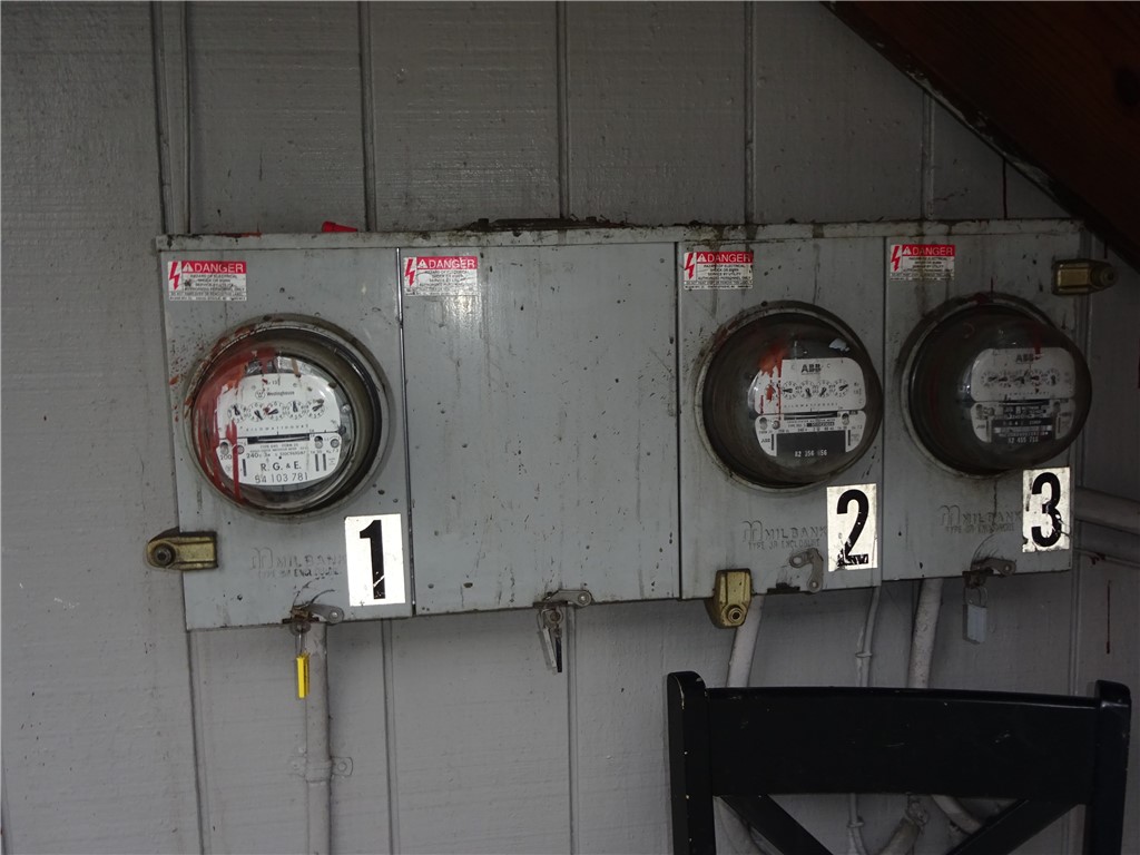 115 Murray Street Rochester, NY 14606 - Photo 27 of 35 Separate electric meters outside under stairway.