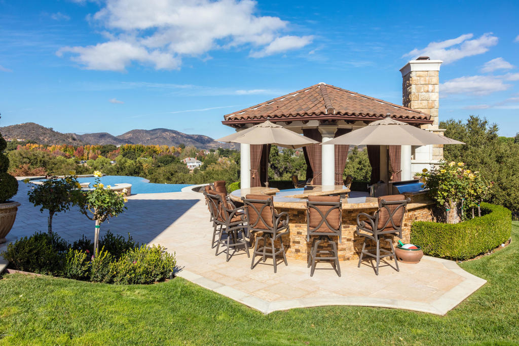 2705 Elderoak Road Thousand Oaks, CA 91361 - Photo 18 of 20 a view of a white house with a yard and sitting area