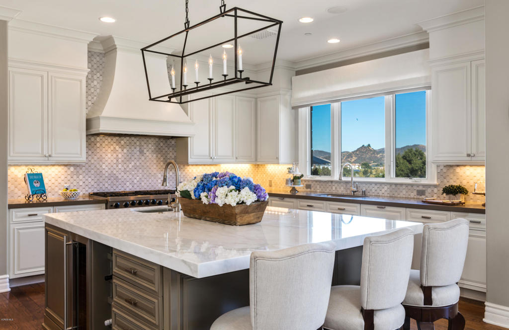 2705 Elderoak Road Thousand Oaks, CA 91361 - Photo 8 of 20 a kitchen with stainless steel appliances granite countertop a sink a stove and a refrigerator