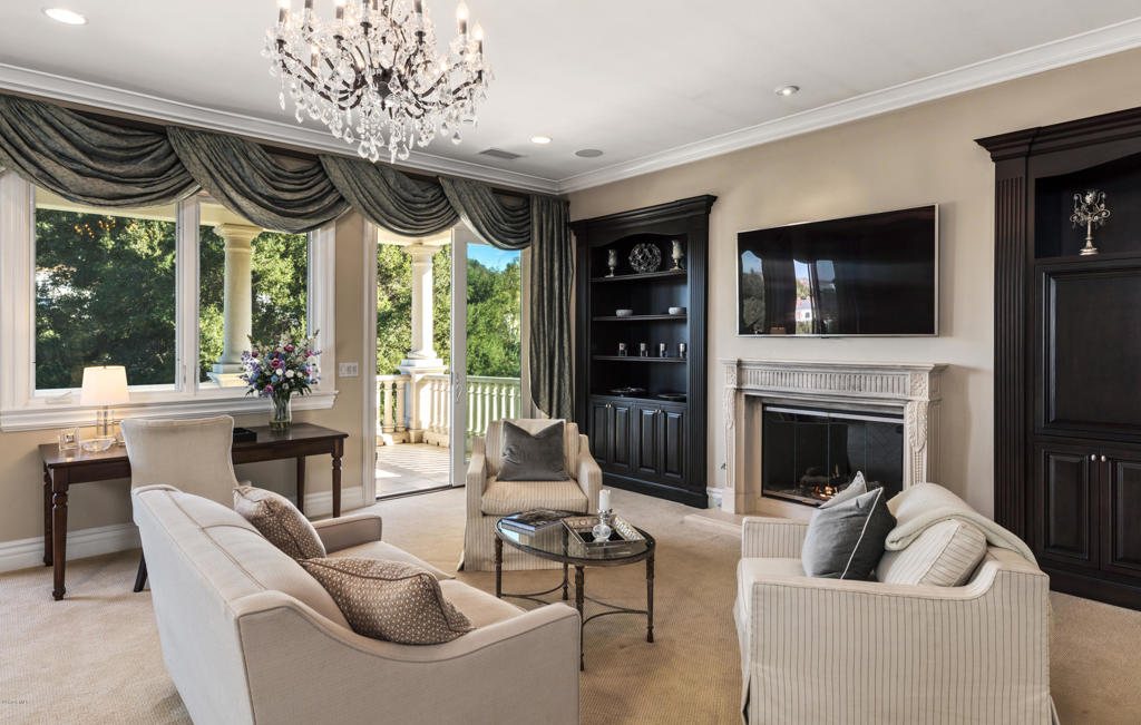 2705 Elderoak Road Thousand Oaks, CA 91361 - Photo 10 of 20 a living room with furniture a flat screen tv and a fireplace