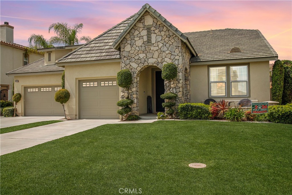8267 Golden Poppy Road Riverside, CA 92508 - Photo 1 of 1 a front view of a house with a yard